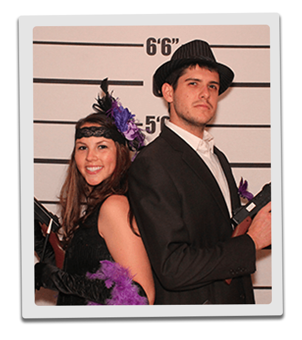 Atlanta Murder Mystery party guests pose for mugshots