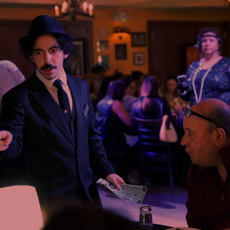 A detective questioning a guest at a Atlanta show